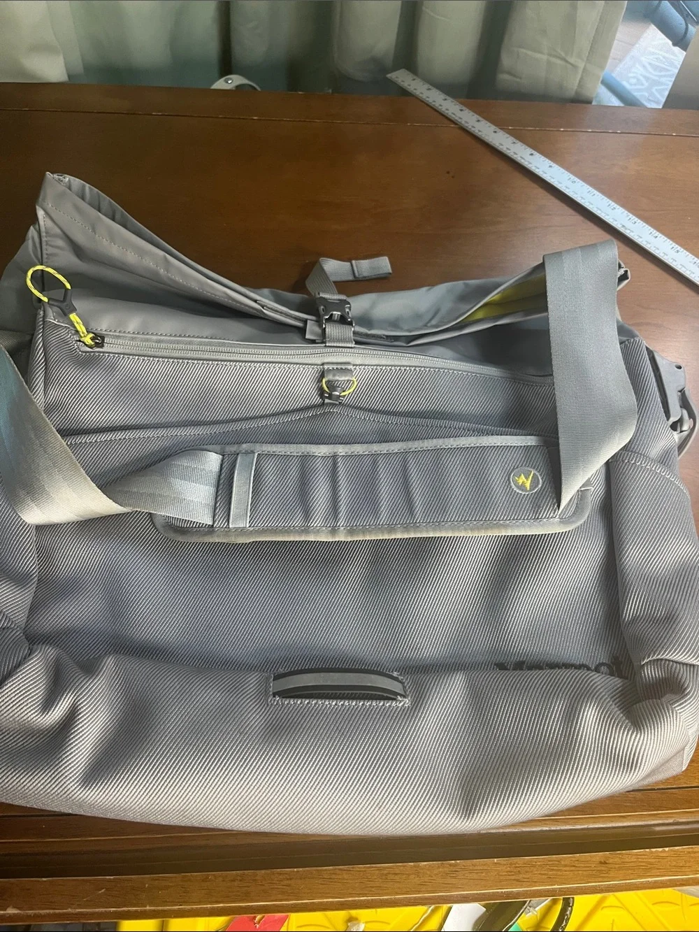 Marmot Light Gray Roll-Top Laptop Messenger Bag with Yellow Accents